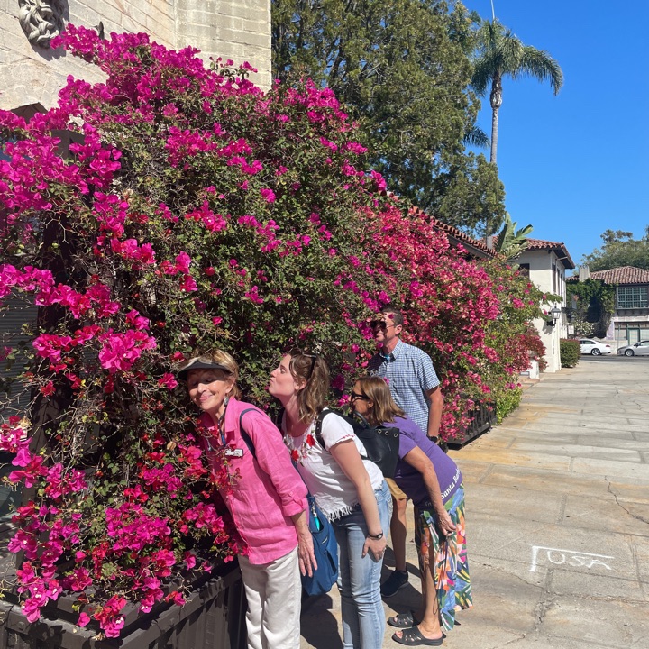 Scavenger Hunt participants stopping to smell the flowers
